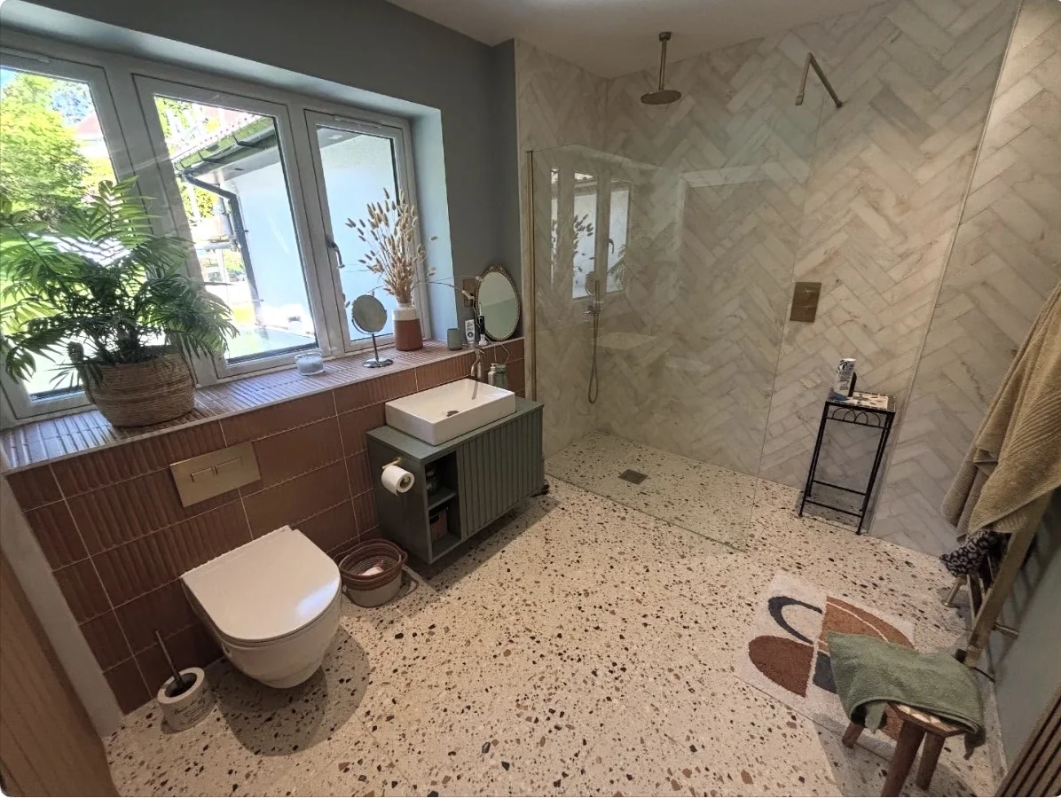 Completed bathroom renovation with walk-in shower