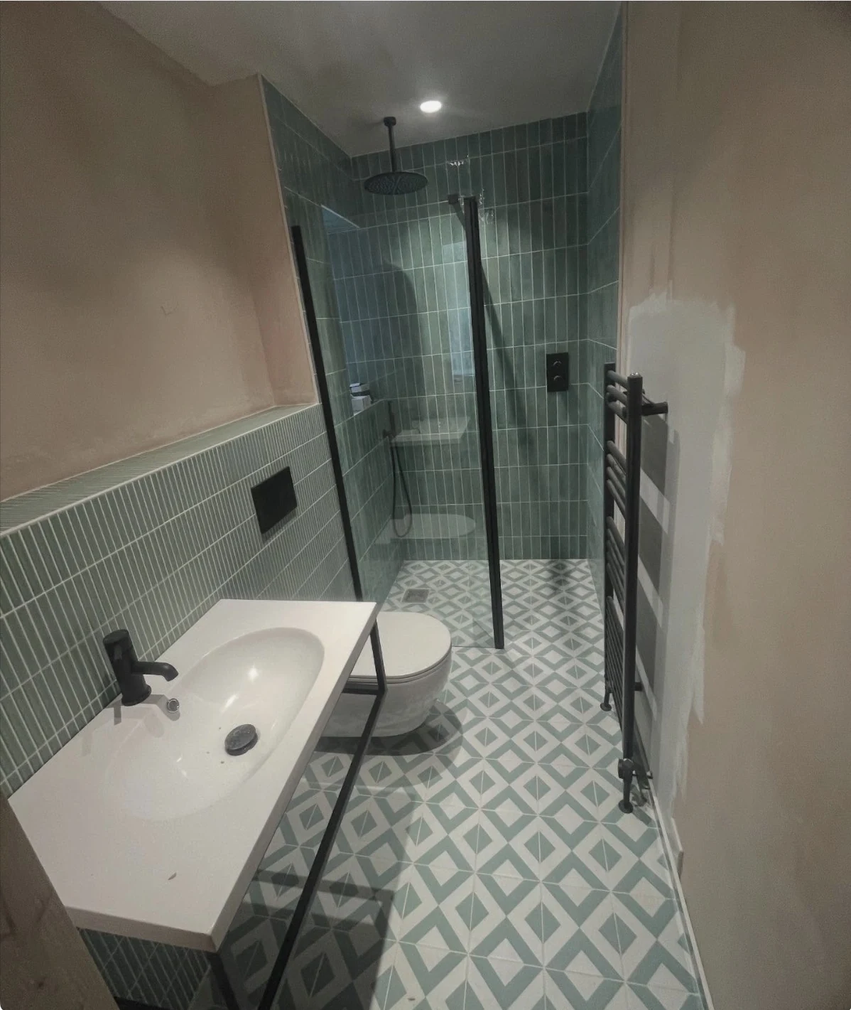 Completed green tiled wet room renovation